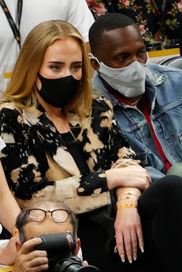 PHOENIX, ARIZONA - JULY 17: Singer Adele looks on next to Rich Paul during the first half in Game Fi...