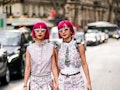 Fashion twins Ami and Aya Suzuki have hot pink hair and wear a floral print dresses during Paris Fas...