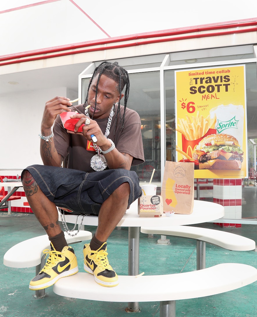 DOWNEY, CALIFORNIA - SEPTEMBER 08: Travis Scott surprises crew and customers at McDonald's for the l...