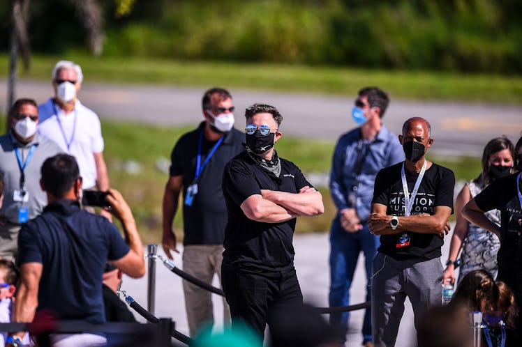 SpaceX CEO Elon Musk (C) looks on during the Inspiration4 crew send off at NASAs Kennedy Space Cente...