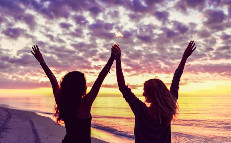 Cute happy teen girls on the beach