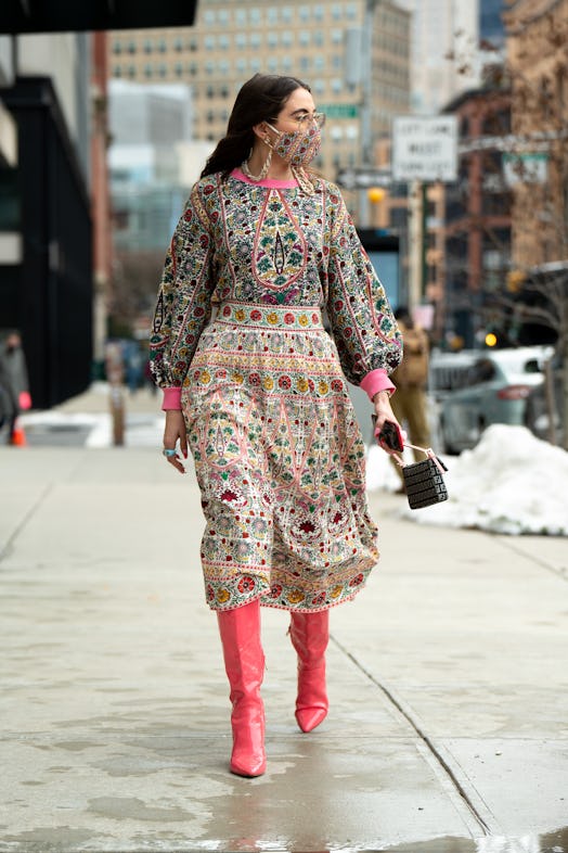 A printed dress with colorful tall boots.
