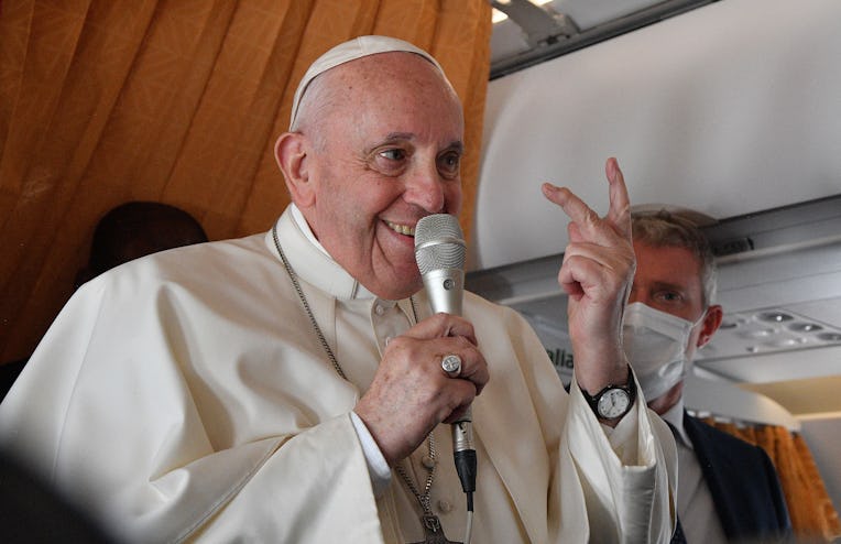 Pope Francis speaks with journalists on board an Alitalia aircraft enroute from Bratislava's Milan R...