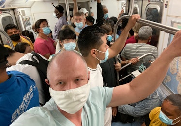 Manhattan, New York, USA - July 6, 2021: Crowded number 5 subway train after lockdown was lifted in ...