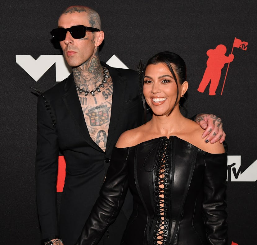 Kourtney Kardashian and Travis Barker's matching name necklaces are proof that PDA can be wholesome.