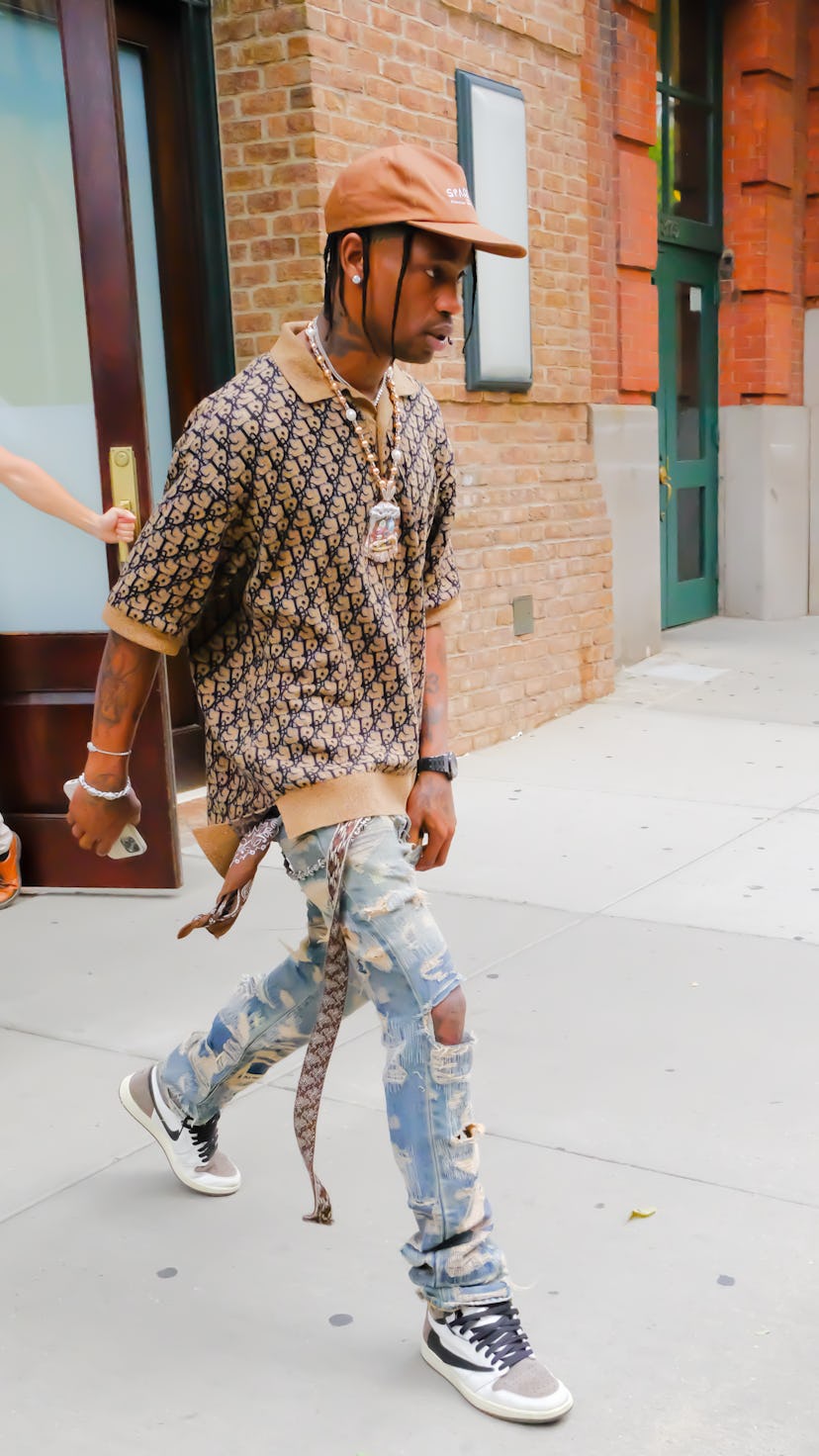 NEW YORK, NY - JULY 08:  Travis Scott is seen in walking out of a hotel in SoHo on July 8, 2021 in N...