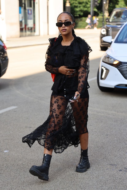 LONDON, ENGLAND - SEPTEMBER 18: Guest wearing black lace dress, sunglasses attends yuhan wang at TIK...