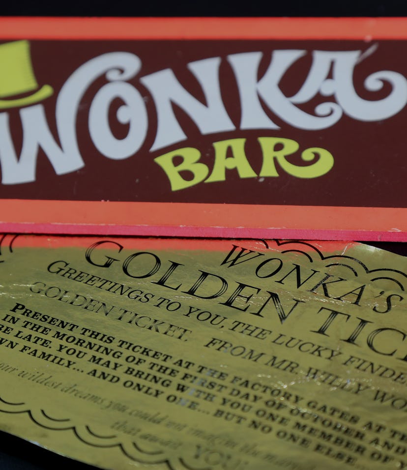 Two of the most iconic film props - a Golden Ticket and Wonka Bar from the 1971 film Willy Wonka & t...
