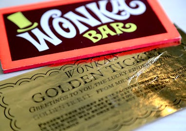 Two of the most iconic film props - a Golden Ticket and Wonka Bar from the 1971 film Willy Wonka &am...