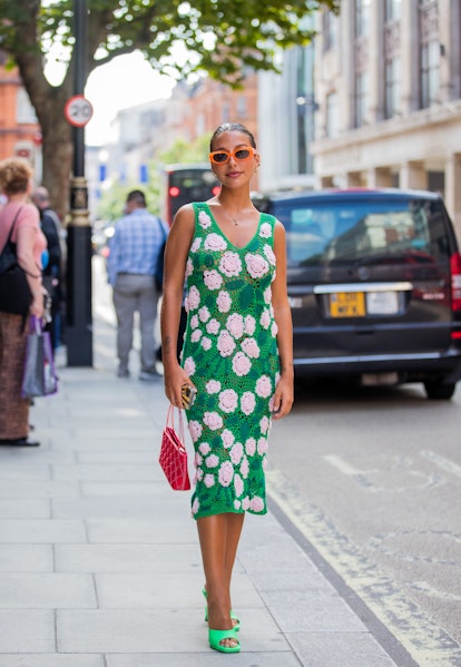 LONDON, ENGLAND - SEPTEMBER 18: Guests outside waring green sheer dress with floral print yuhan wang...