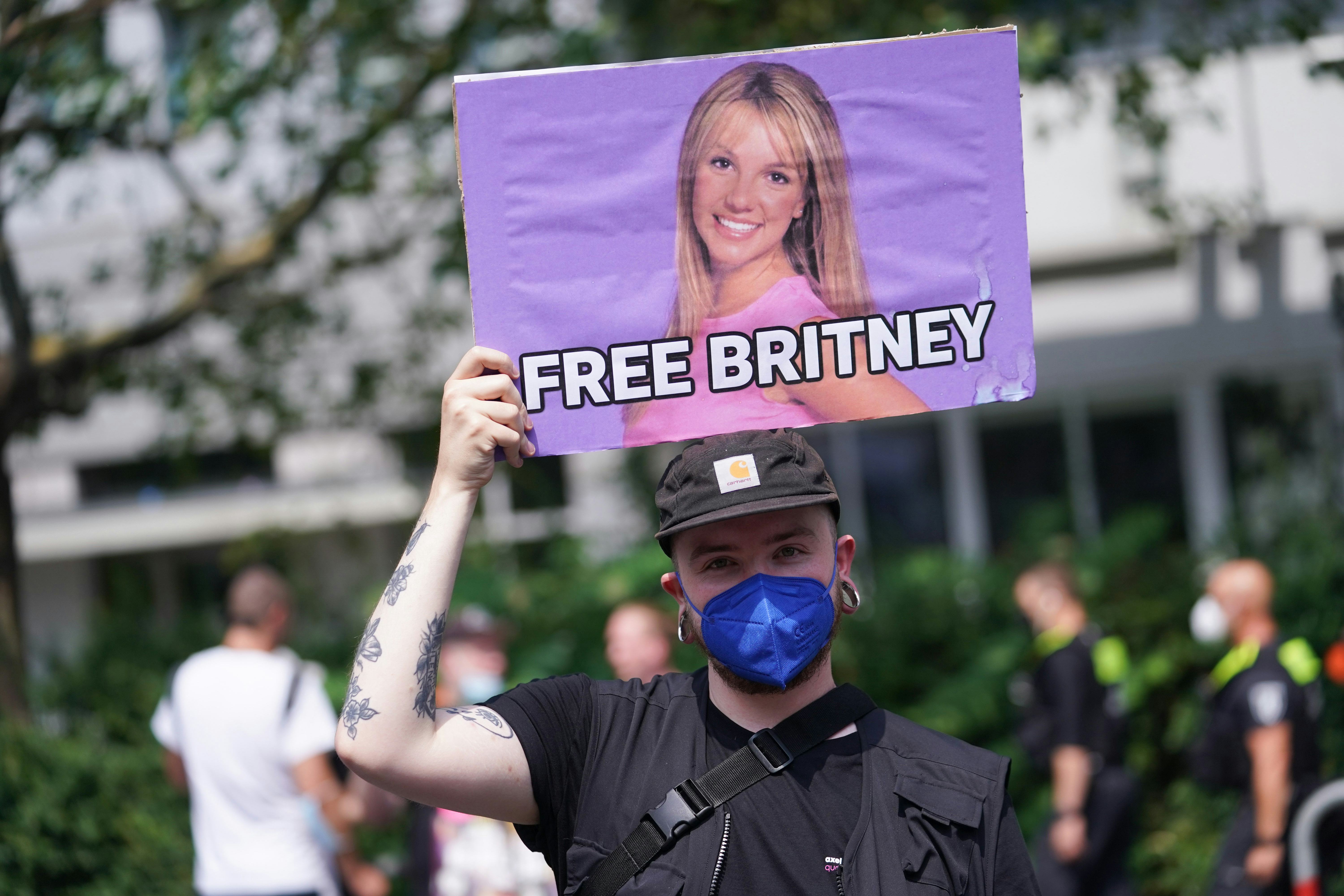 24 July 2021, Berlin: A banner reading &ldquo;Free Britney&rdquo; is seen at the Christopher Street Day (CSD) pa&hellip;