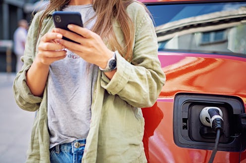 Woman checks Twitter followers on her phone to see who unfollowed her.