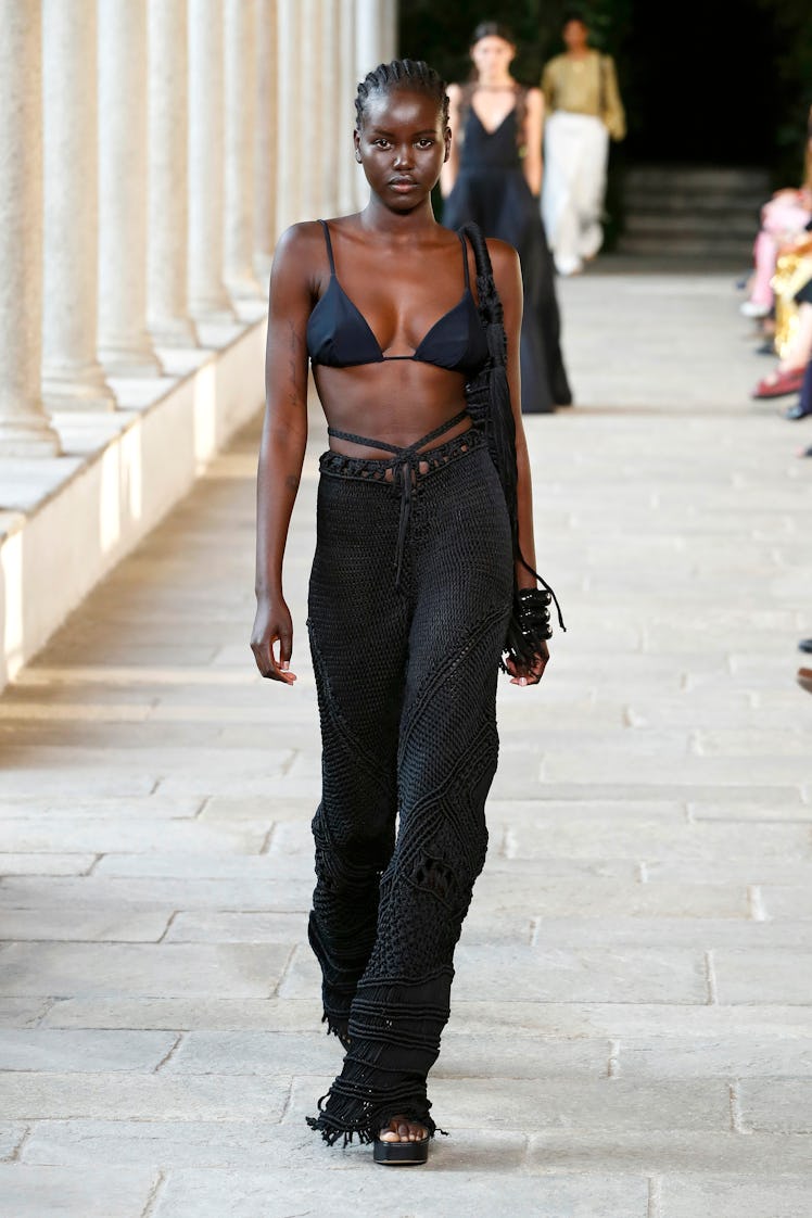 A model on the runway at the Alberta Ferretti fashion show during Milan Fashion Week in a black bra ...
