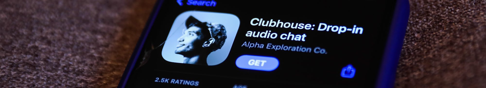 Clubhouse Drop-in audio chat app logo on the App Store is seen displayed on a phone screen in this i...