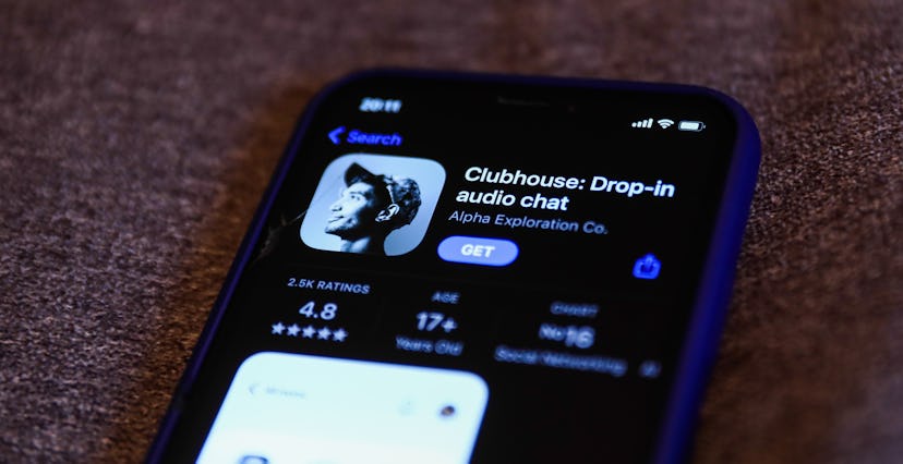 Clubhouse Drop-in audio chat app logo on the App Store is seen displayed on a phone screen in this i...