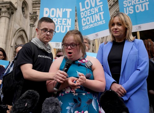 Heidi Crowter (middle) with Maire Lea-Wilson (right) speaking to the media outside the High Court in...