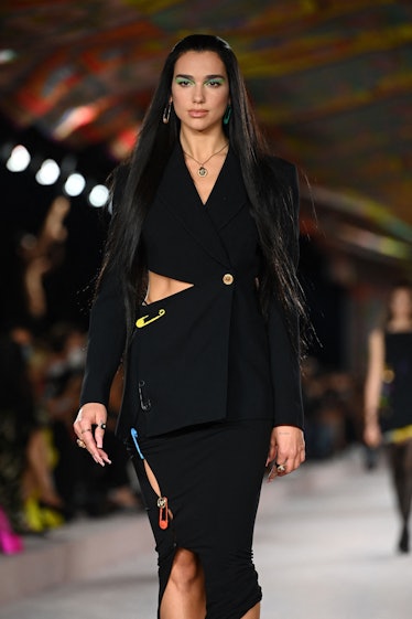 British singer and model Dua Lipa presents a creation for Versace's Women's Spring-Summer 2022 colle...