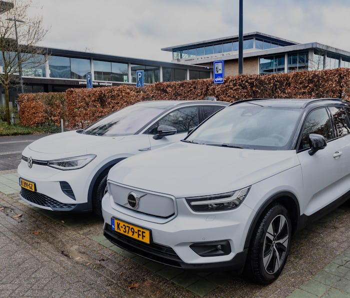 Volkswagen ID.4 and Volvo XC40 Recharge Pure electric crossover SUV cars at an electric vehicle char...