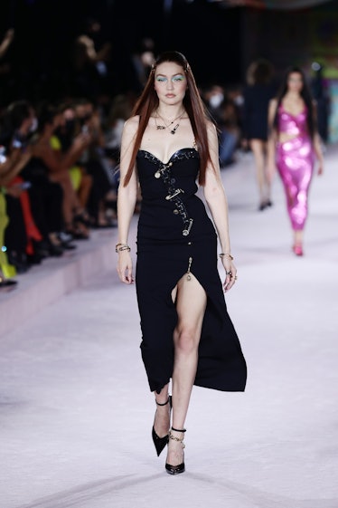 MILAN, ITALY - SEPTEMBER 24: Gigi Hadid walks the runway at the Versace fashion show during the Mila...
