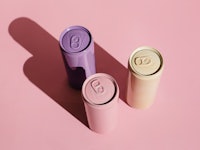 Pink, beige, lilac aluminum drink cans on pink background. Minimal creative still life. Zero waste, ...