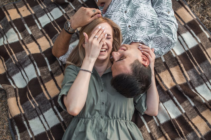 Young couple in love on sunny day in the park