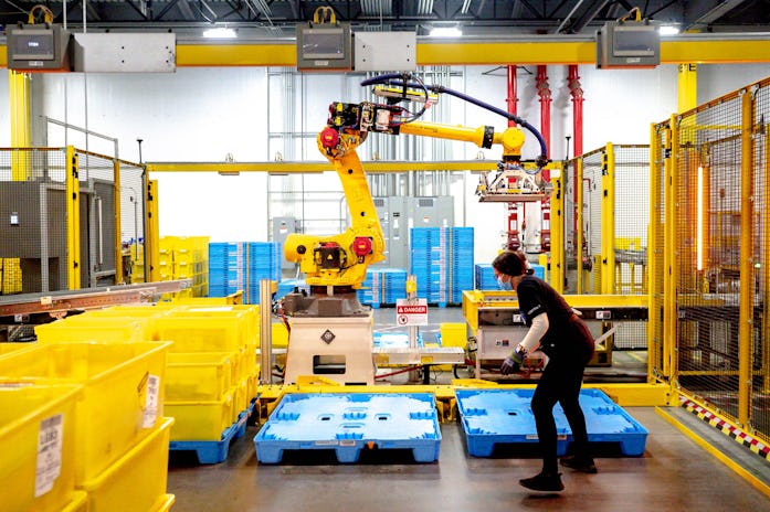 EASTVALE, CA - AUGUST 31: A robot sorts and stacks bins at Amazon fulfillment center in Eastvale on ...