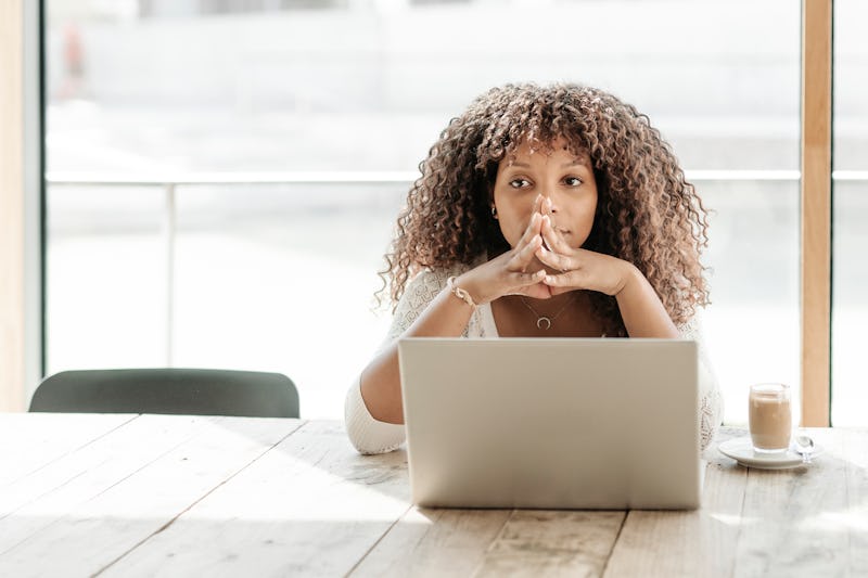 Overworked female adult emotions stress frustration exhaustion using laptop home interior