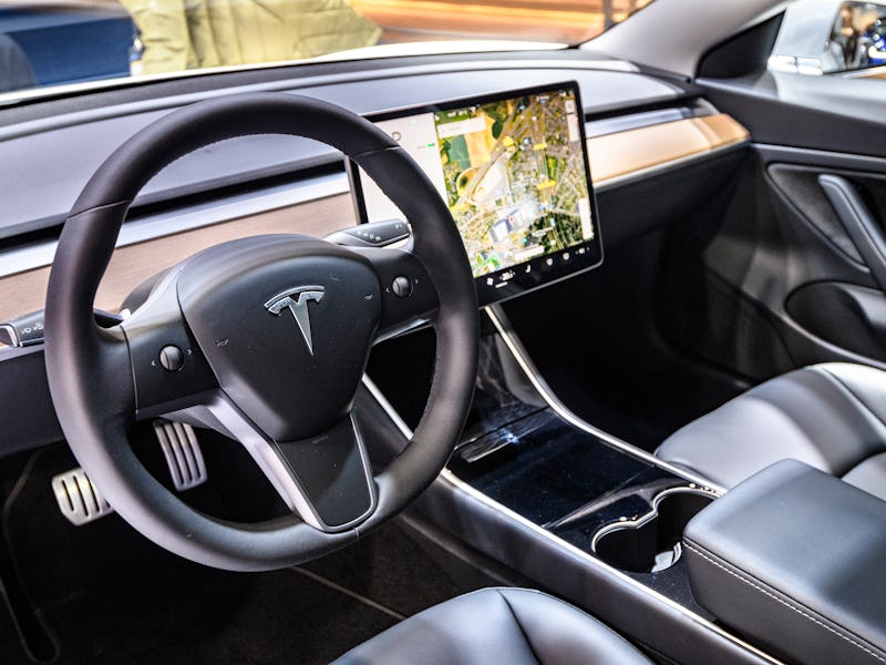 BRUSSELS, BELGIUM - JANUARY 9: Tesla Model 3 compact full electric car interior with a large touch s...