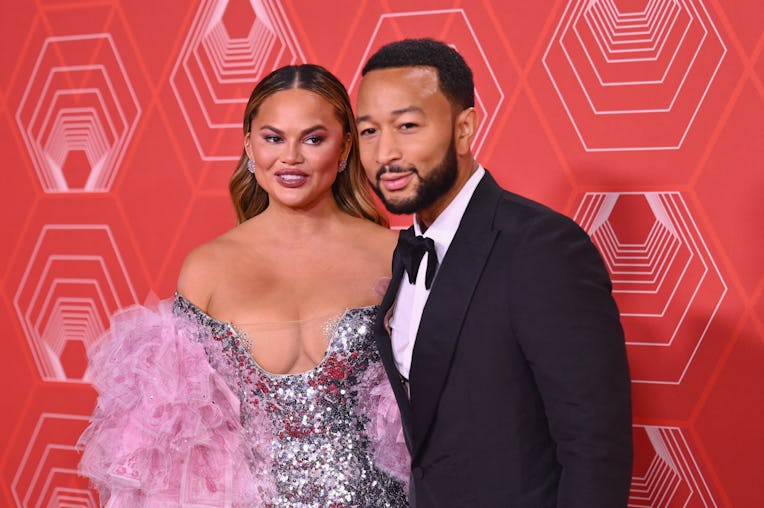 US singer-songwriter John Legend and his wife model Chrissy Teigen attend the 74th Annual Tony Award...