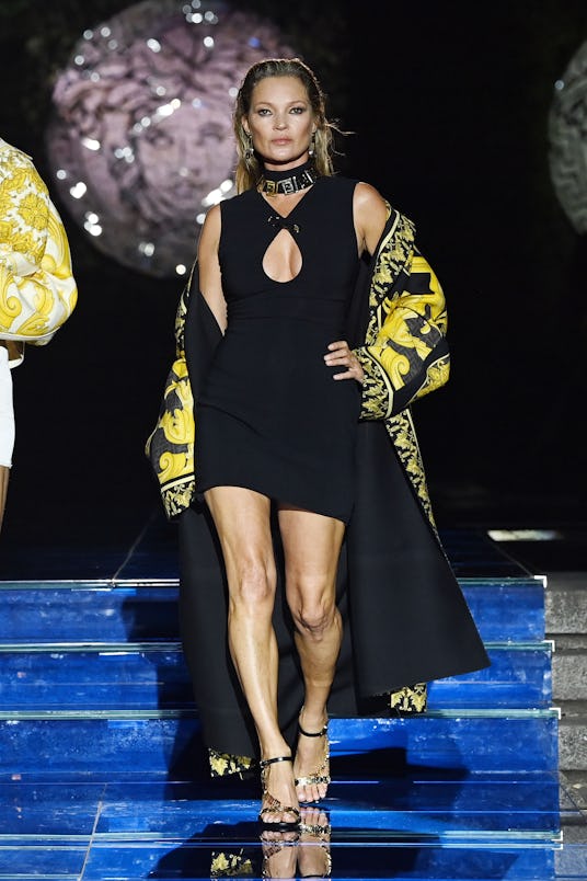 MILAN, ITALY - SEPTEMBER 26: Kate Moss walks the runway at the Versace special event during the Mila...