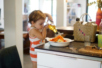 Having your toddler help cook dinner can introduce them to new spices and flavors.