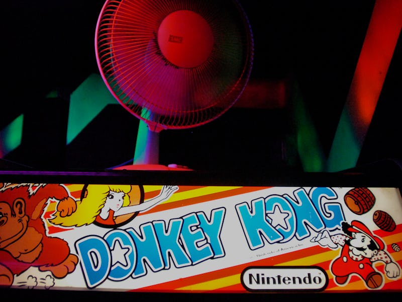 Neon fans, paint and vintage games like Nintendo's Donkey Kong fill an arcade room at Oskar Blues in...