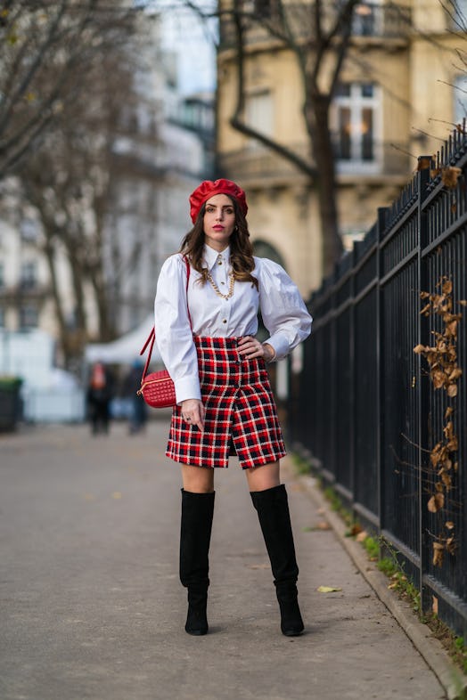 Sara Carnicella wears a beret, white shirt with puff sleeves from Victoria Tomas, and a red and blue...