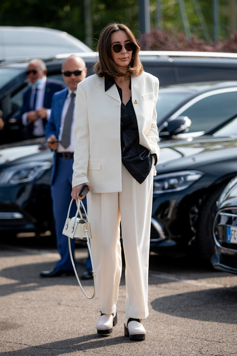 MILAN, ITALY - SEPTEMBER 23: A guest outside Boss fashion show during the Milan Fashion Week - Sprin...