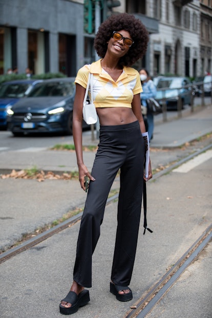 MILAN, ITALY - SEPTEMBER 25: Model outside Dolce & Gabbana fashion show during the Milan Fashion Wee...