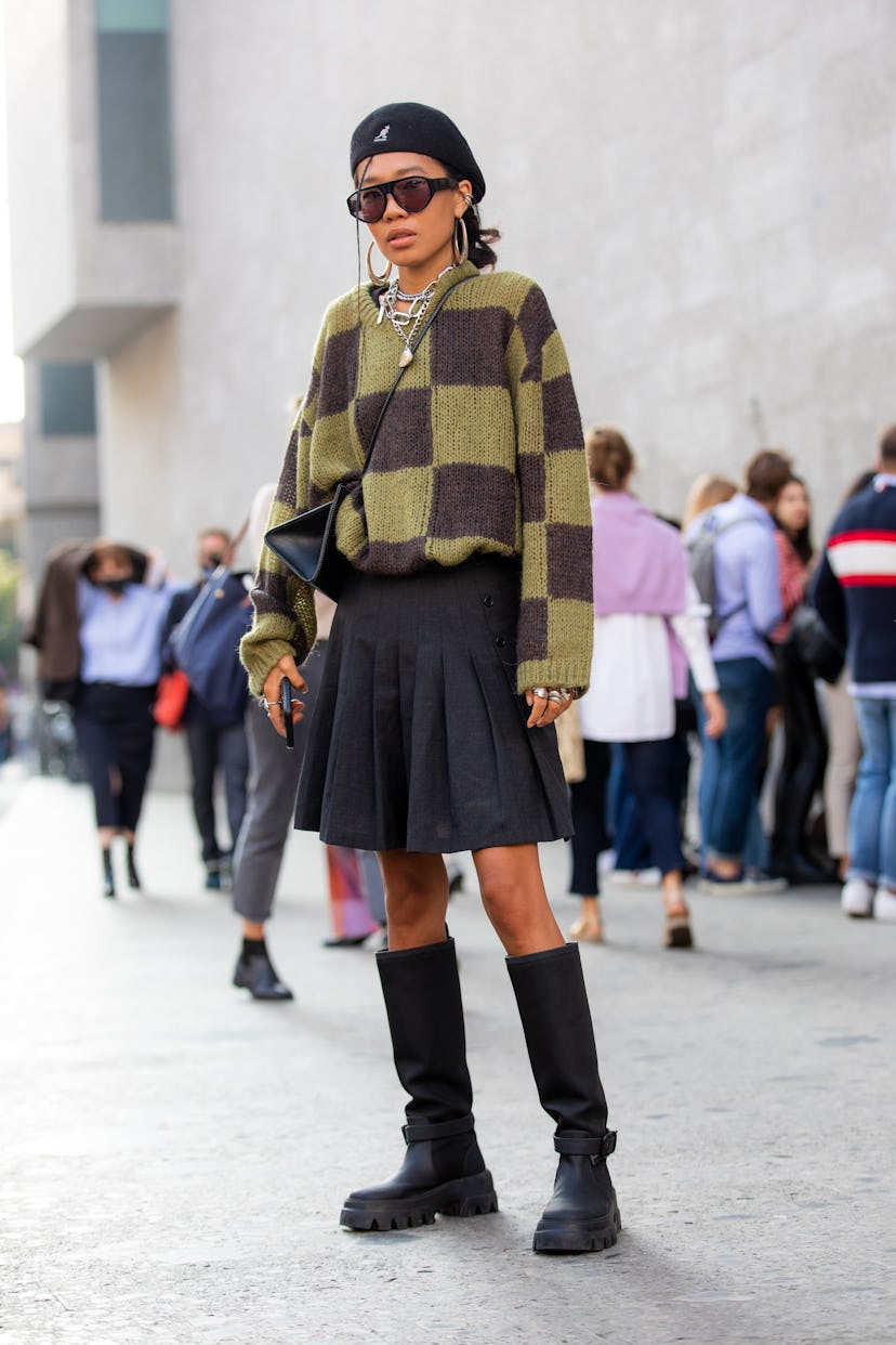 MILAN, ITALY - SEPTEMBER 23: Baya Gorbunova outside Max Mara fashion show wearing a square swater, b...