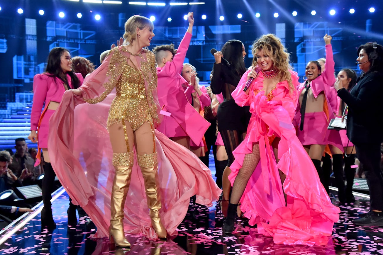 LOS ANGELES, CALIFORNIA - NOVEMBER 24: (L-R) Taylor Swift, Ciara, and Shania Twain are seen onstage ...