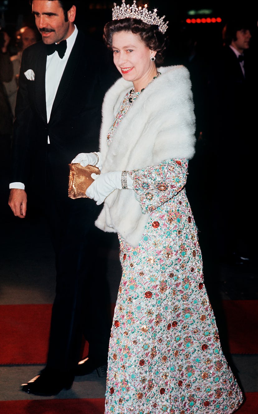 Queen Elizabeth wore a white fur stole to a movie premiere.