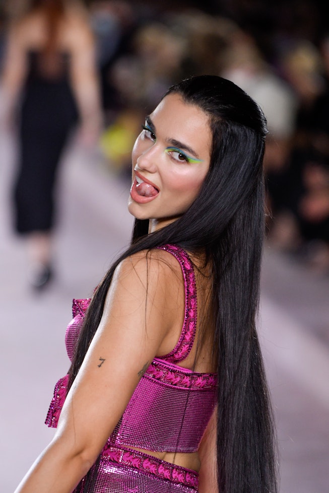 MILAN, ITALY - SEPTEMBER 24: Dua Lipa walks the runway at the Versace fashion show Spring Summer 202...