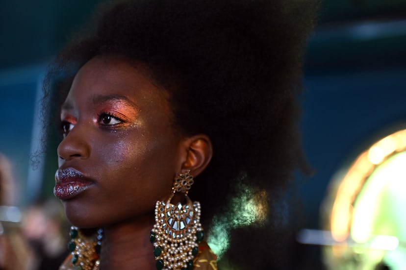 A model backstage ahead of the OSMAN  show during London Fashion Week September 2021 on September 20...