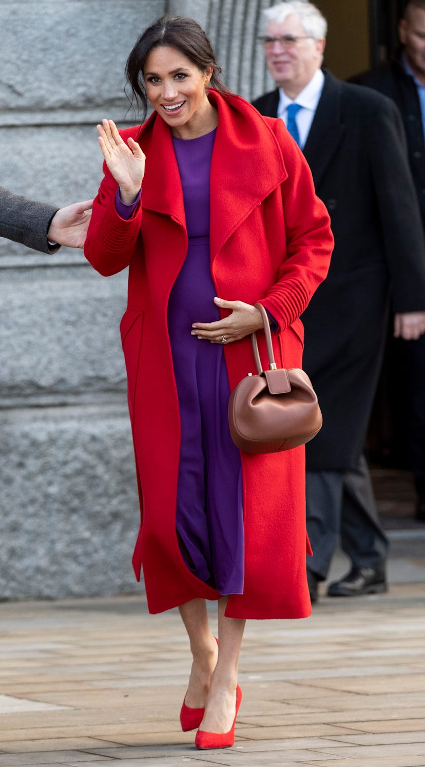 Though Meghan Markle usually wears neutrals, this bright colored look was a memorable maternity styl...