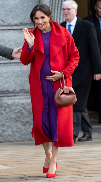 Though Meghan Markle usually wears neutrals, this bright colored look was a memorable maternity styl...