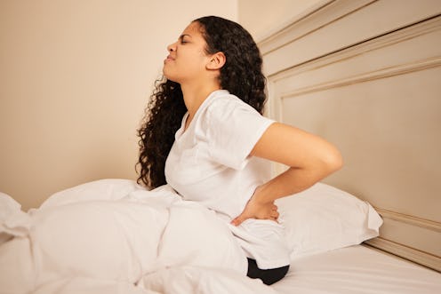 Experts share tips for how to sleep with back pain.