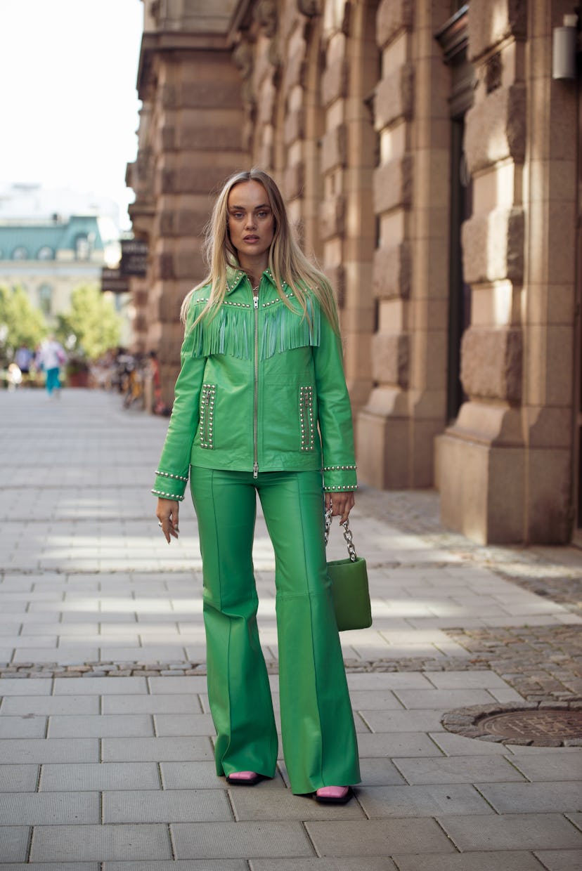 STOCKHOLM, SWEDEN - AUGUST 31: Amanda Winberg wearing green leather suit with metal details and gree...