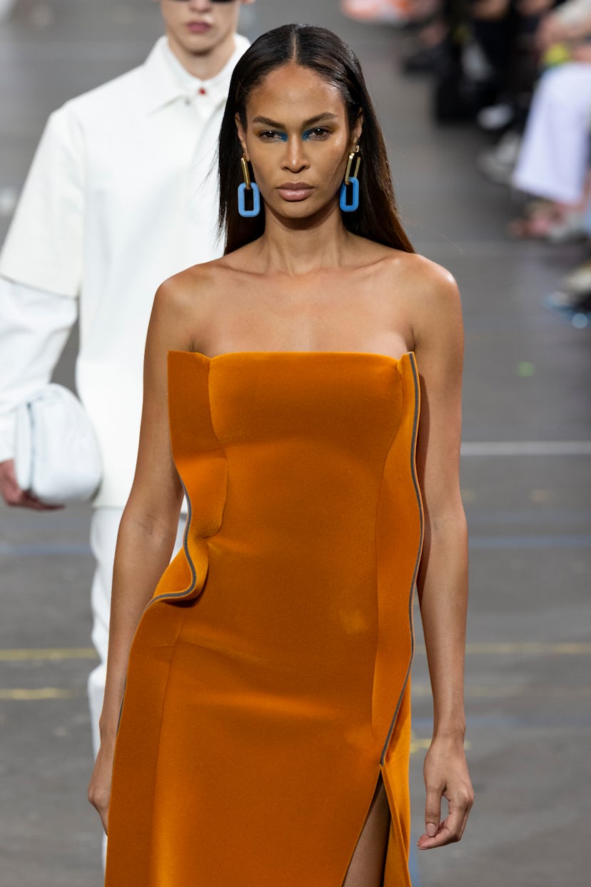 A top fall 2021 makeup trend: Joan Smalls at OFF-WHITE Fall Winter 2021 with bright inner corner eye...