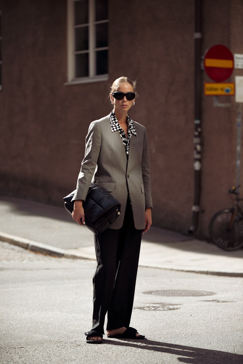 STOCKHOLM, SWEDEN - SEPTEMBER 02: Hilda Sandstrom wearing black pants, white and black checked shirt...