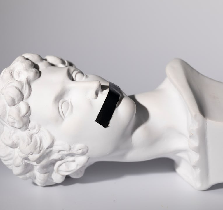 Head sculpture of Giuliano de' Medici created by Michelangelo Buonarroti in 16 century with black ta...