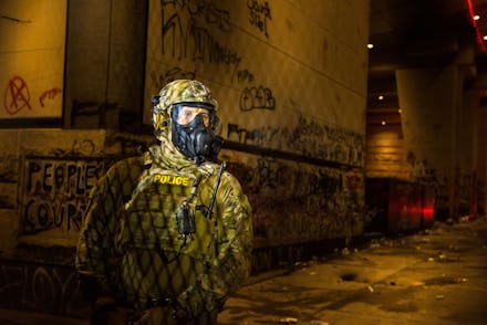 TOPSHOT - Federal police guard the Mark O. Hatfield federal courthouse in downtown Portland as prote...