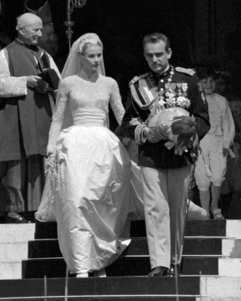 Grace Kelly wore a Cathedral wedding gown, created for her by American costume designer Helen Rose, ...