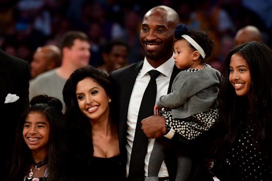 LOS ANGELES, CA - DECEMBER 18:  Kobe Bryant poses with his family at halftime after both his #8 and ...